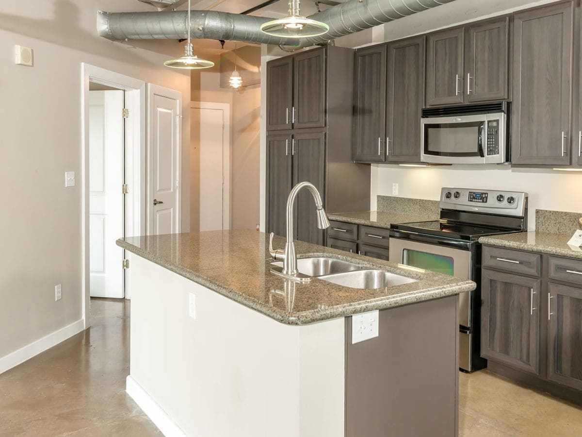 Apartments for Rent in New Braunfels, TX - The Landmark Lofts & Garden Kitchen With Stainless Steel Appliances and Modern Wood Cabinets