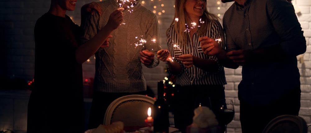 Group,Of,Smiling,Friend,Having,Fun,With,Sparkles,At,Home