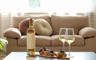 Bottle,Of,A,Vintage,Chardonnay,With,Two,Poured,Glasses,,Figs,