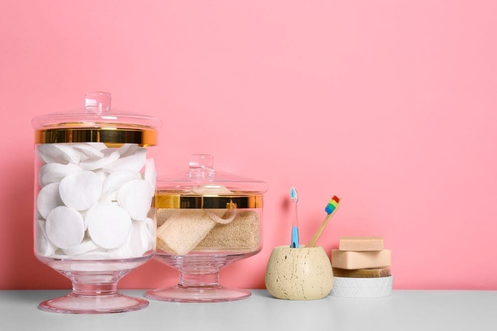 Composition,Of,Glass,Jar,With,Cotton,Pads,On,Table,Near