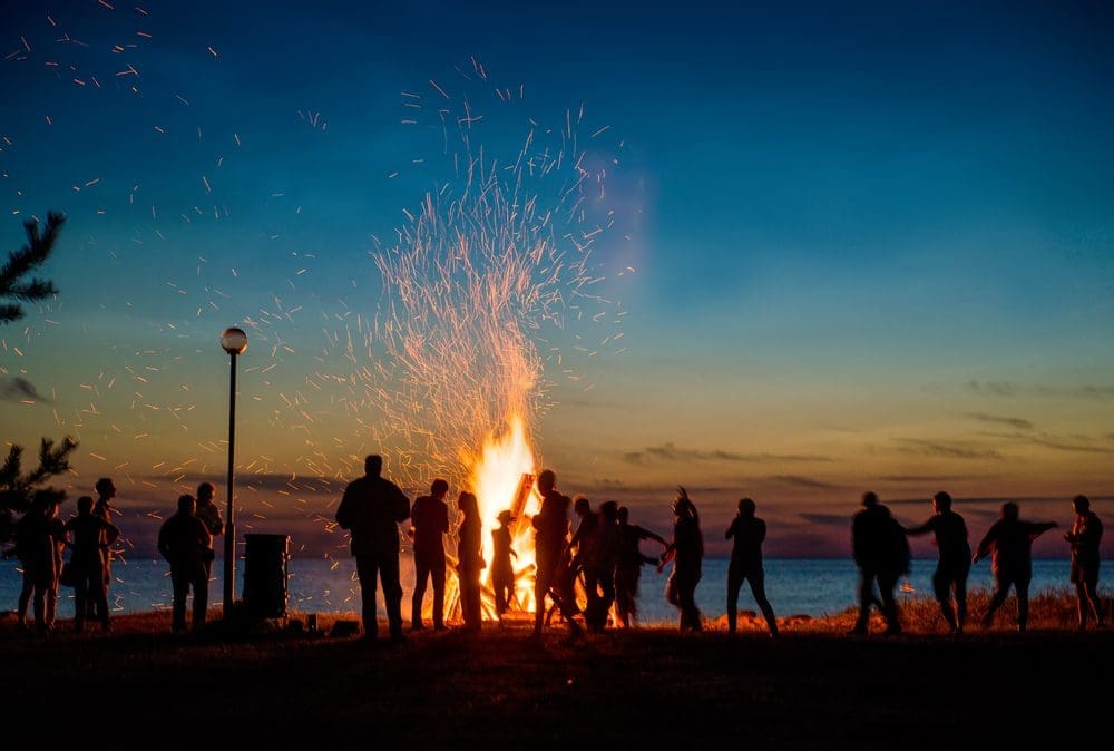 People,Resting,Near,Big,Bonfire,Outdoor,At,Night