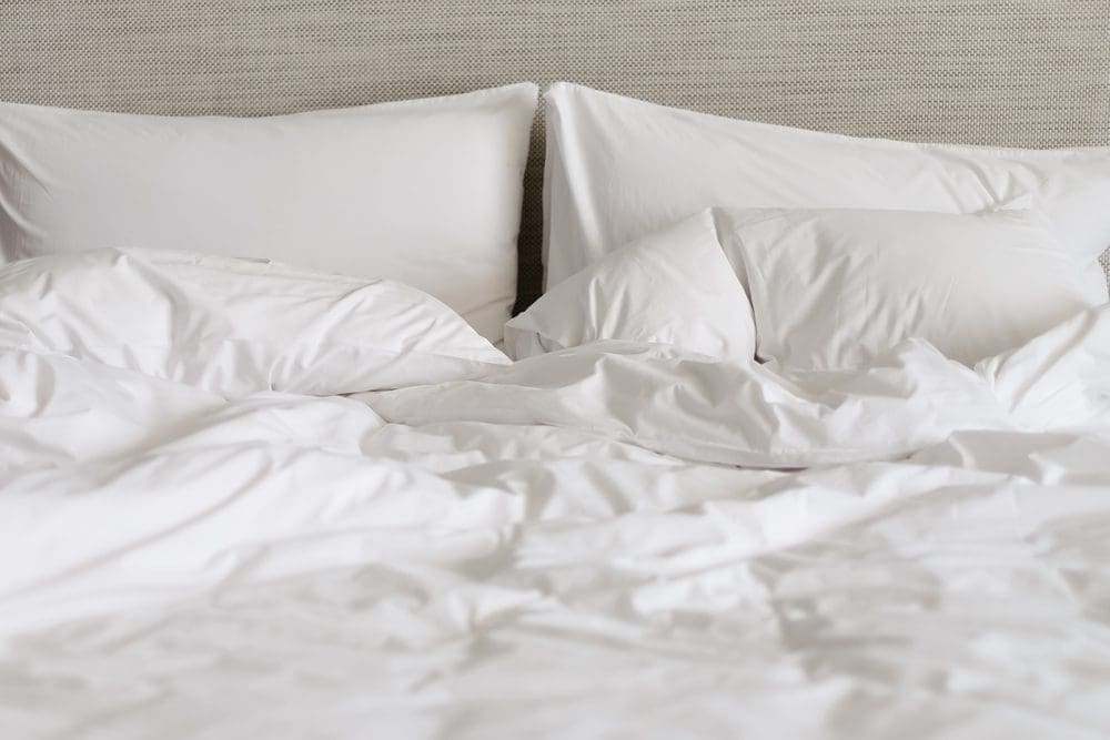 White,Bed,Made-up,With,Wrinkled,Bed,Sheets,After,Sexual,Night.