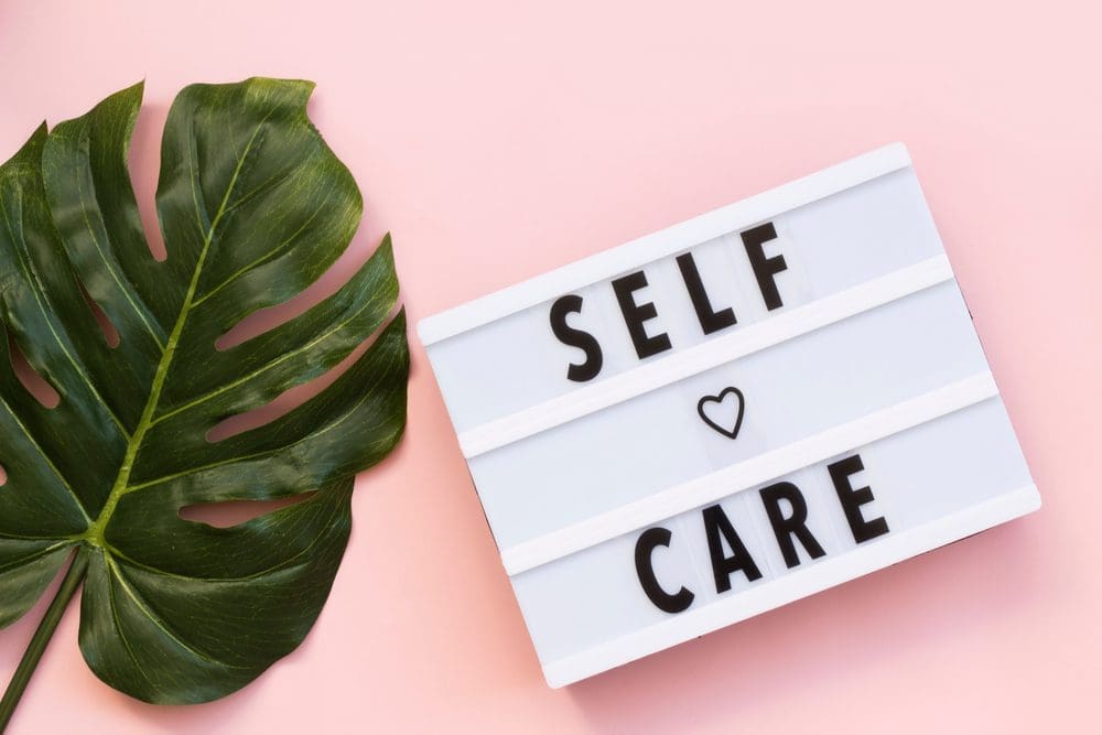 Self-care,Word,On,Lightbox,On,Pink,Background,Flat,Lay.,Take